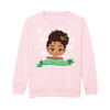 Front view of a pink children’s Christmas sweatshirt by Fefus Designs, featuring a Mixed Race girl with an Afro Puff decorated with festive holly. Soft cotton with ribbed details, promoting inclusivity and celebrating brown girl magic.